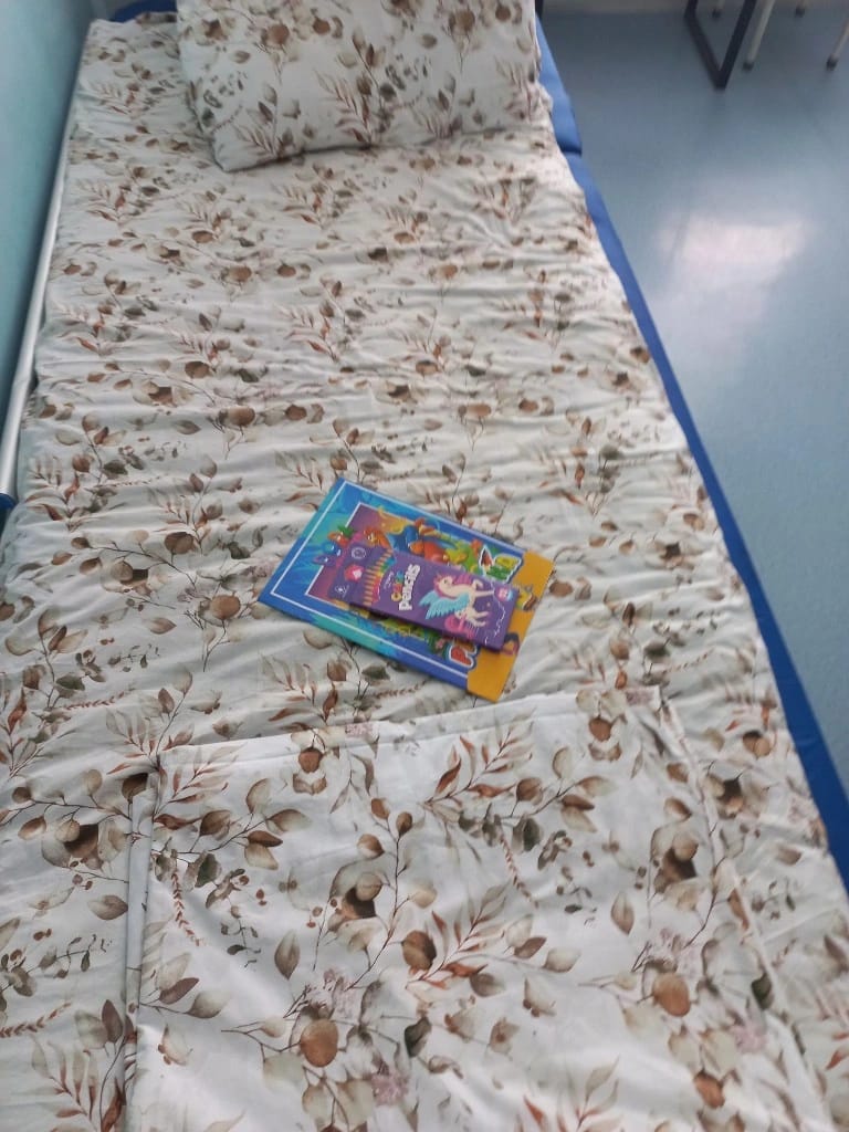 A donated book left on a young patient's hospital bed